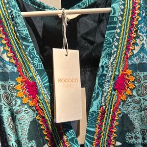 Brand Rocco Sand. Size 10-12 European large.   New with tags.  Shell 100% silk